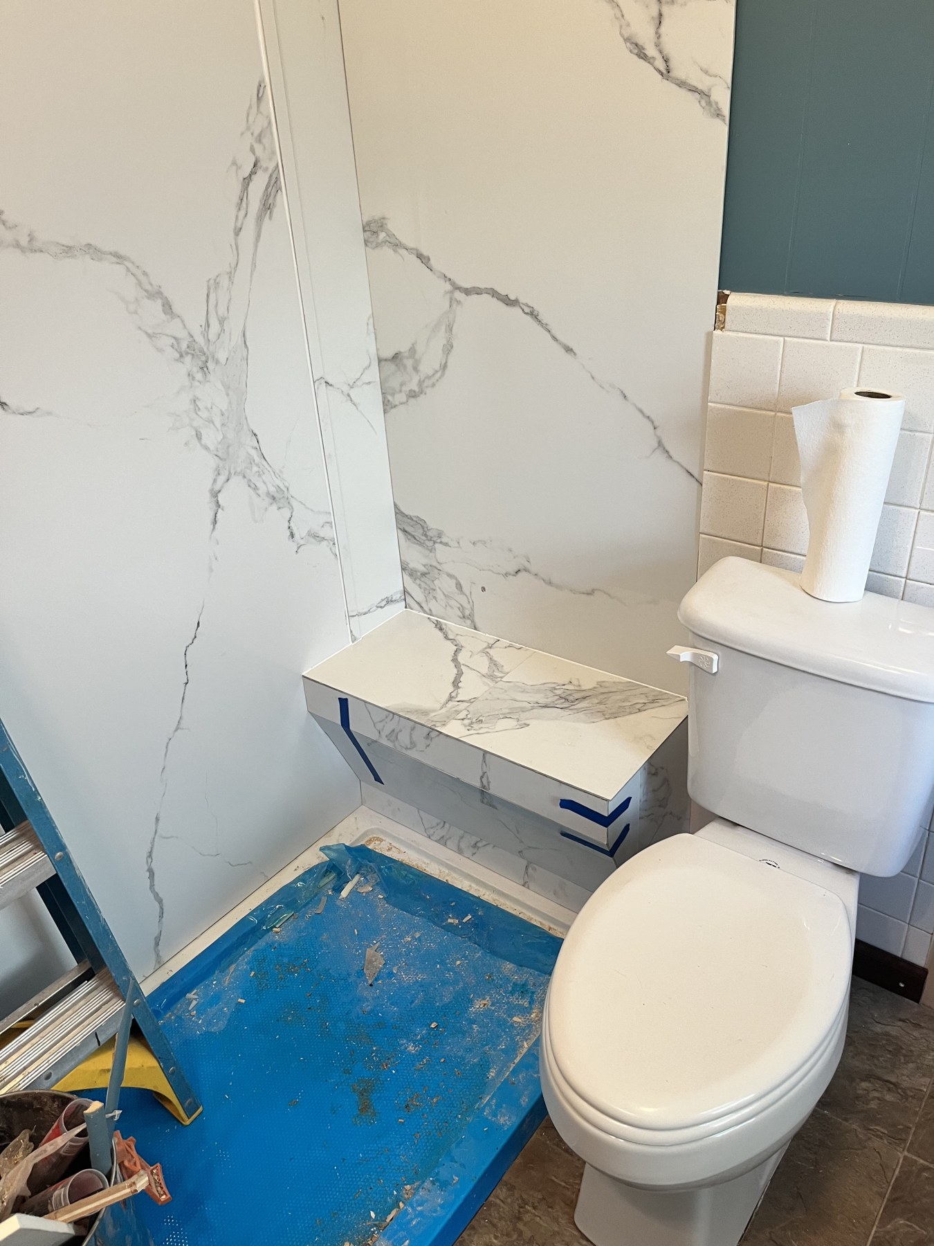 Extended engineered-marble surround installation in progress